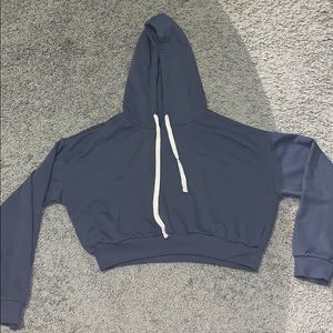 A blue crop top hoodie.